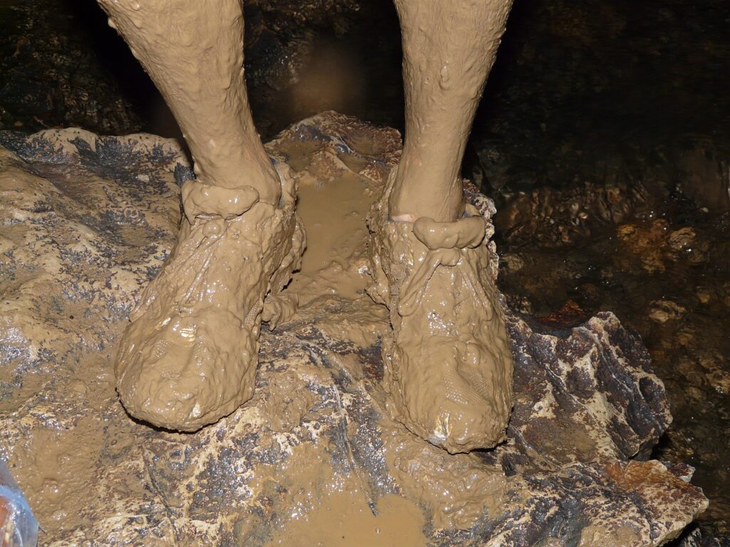 muddy spelunking shoes
